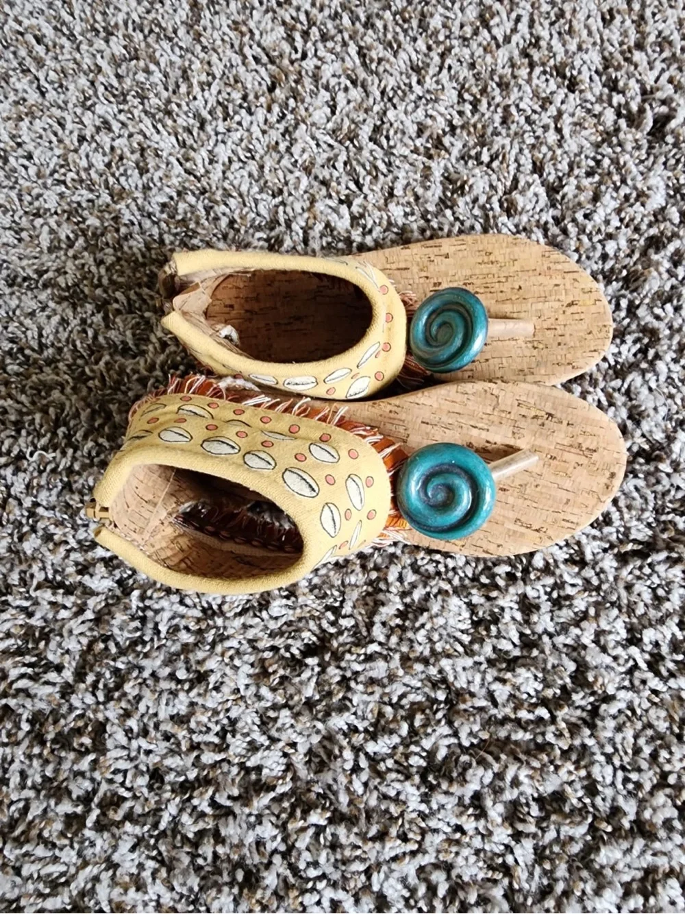 Moana’s Cork Sandals with Teal Spiral. Disney original